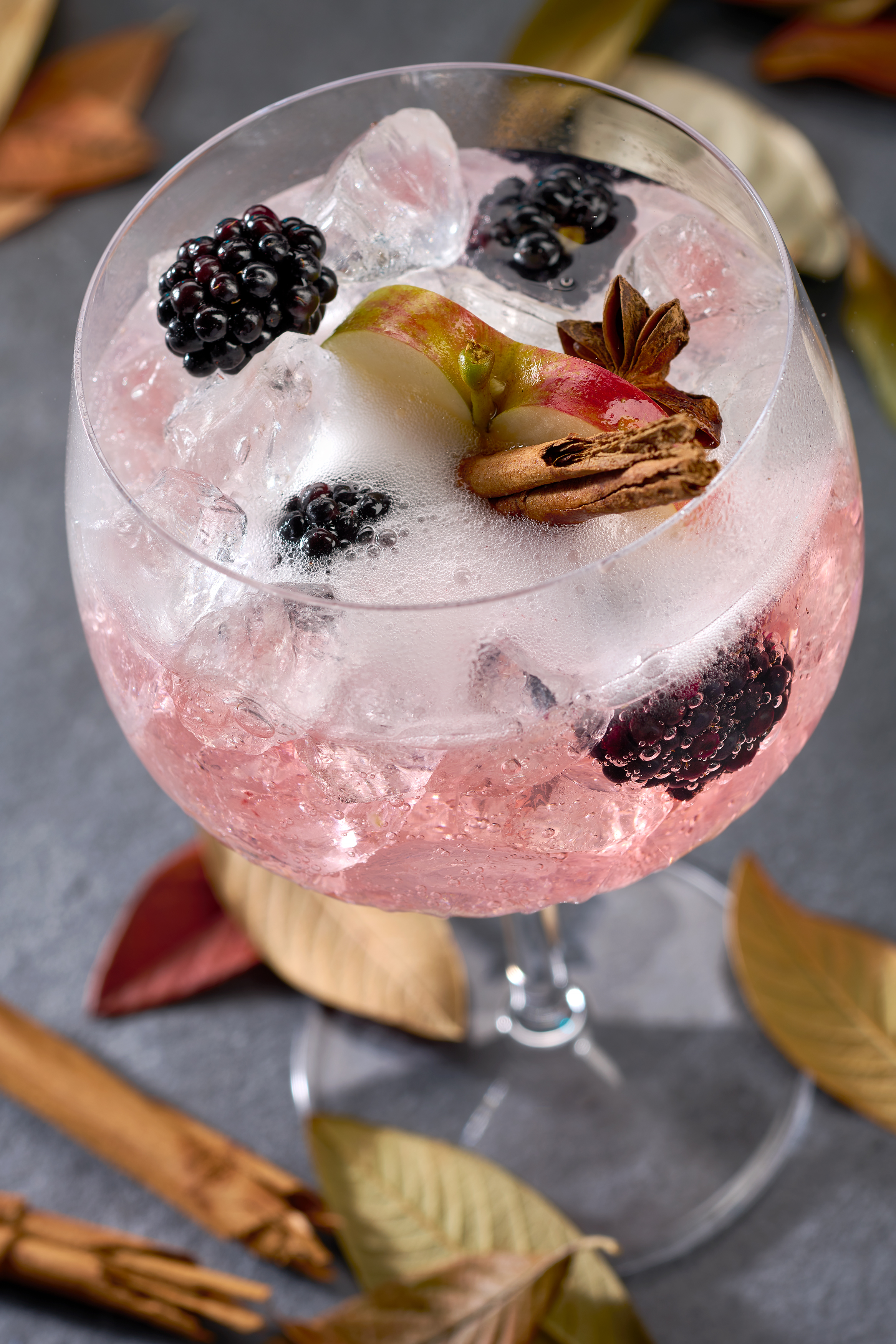 Melford's Gin in a coup glass served with blackberries